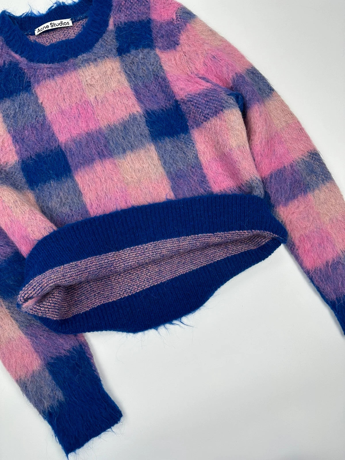 Acne Studios multicolor alpaca wool knit sweater with fuzzy texture and unique patterns.