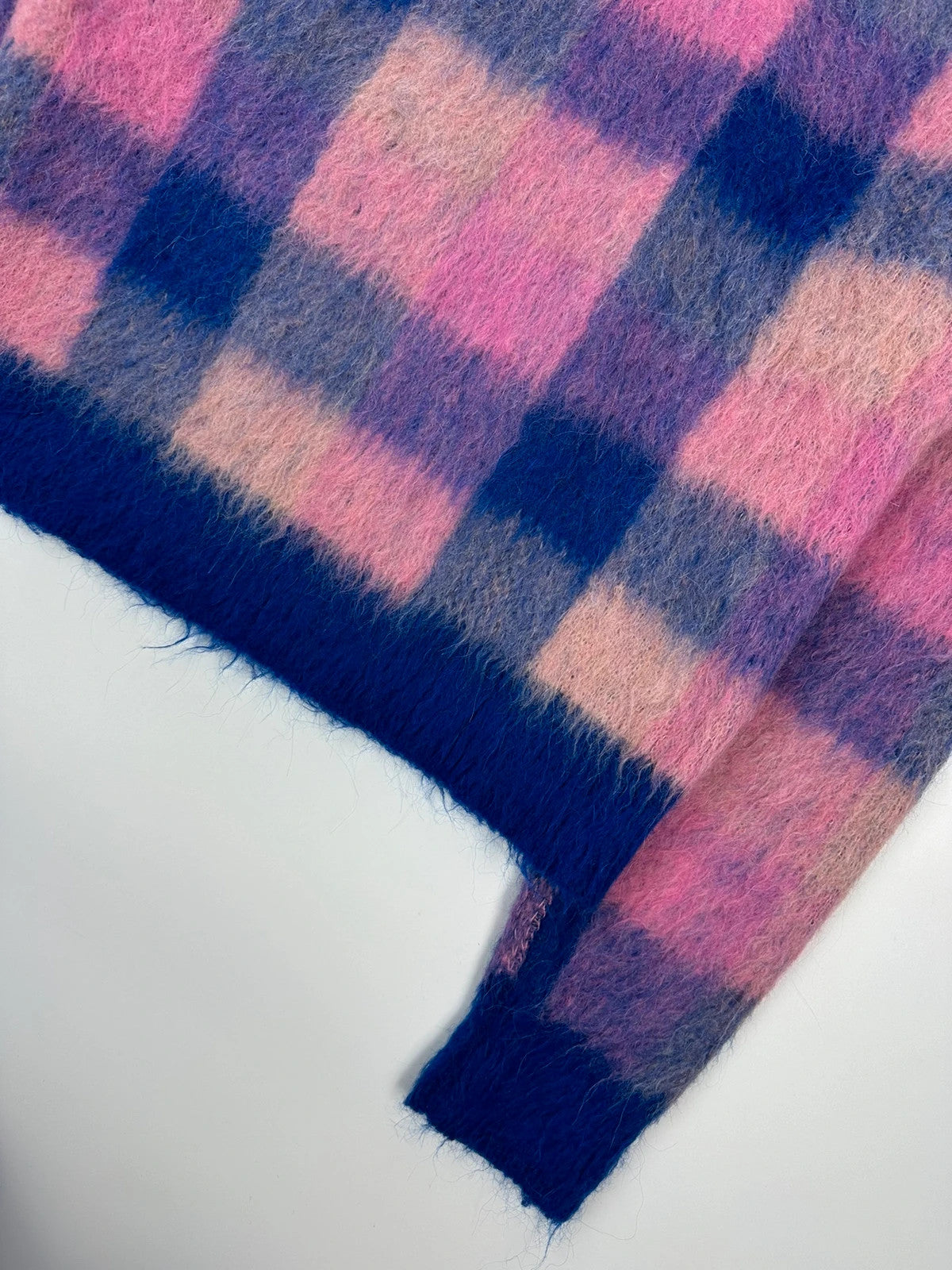 Acne Studios multicolor alpaca wool knit sweater with fuzzy texture and unique patterns.