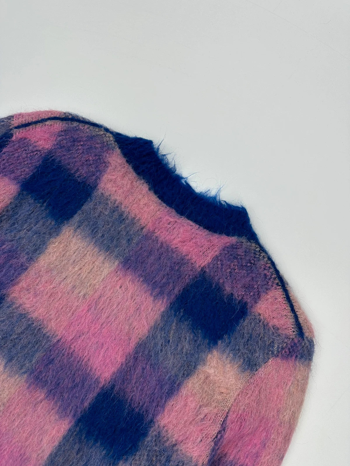 Acne Studios multicolor alpaca wool knit sweater with fuzzy texture and unique patterns.