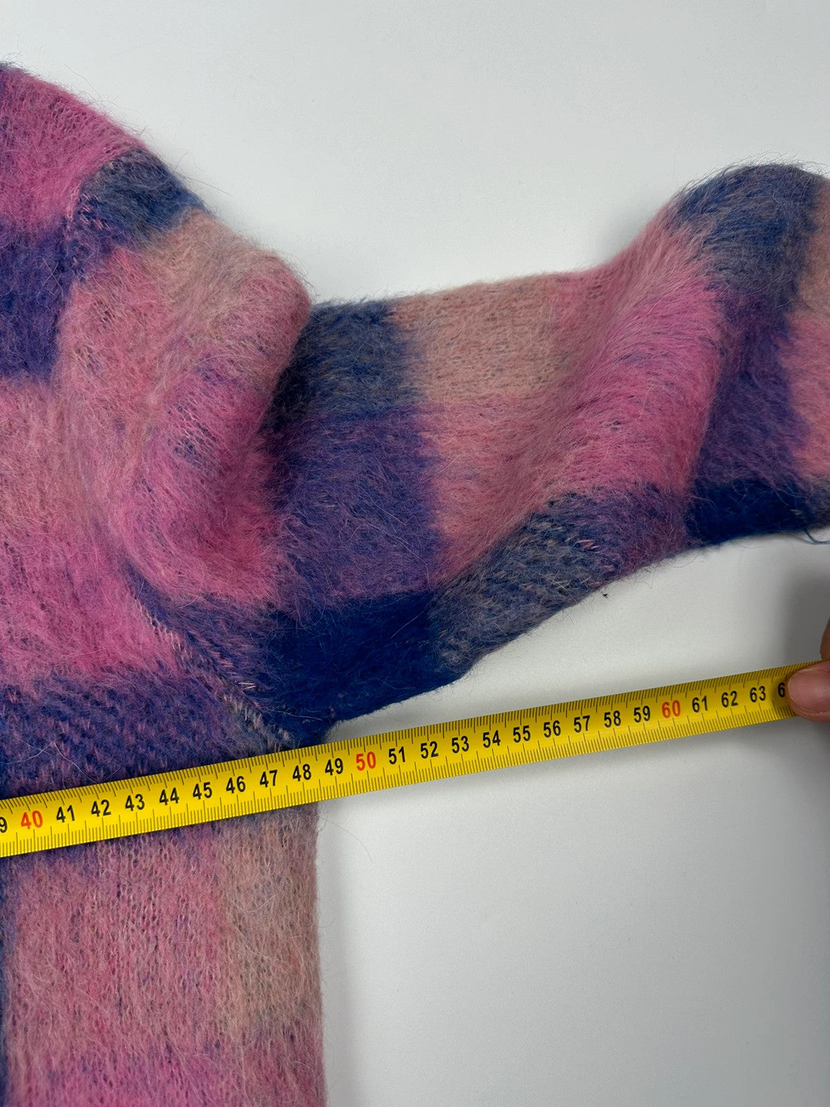 Acne Studios multicolor alpaca wool knit sweater with fuzzy texture and unique patterns.