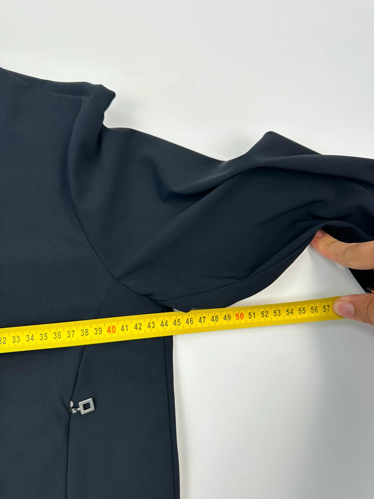 Marithé Francois Girbaud navy crop jacket with V-neck and minimalist design.