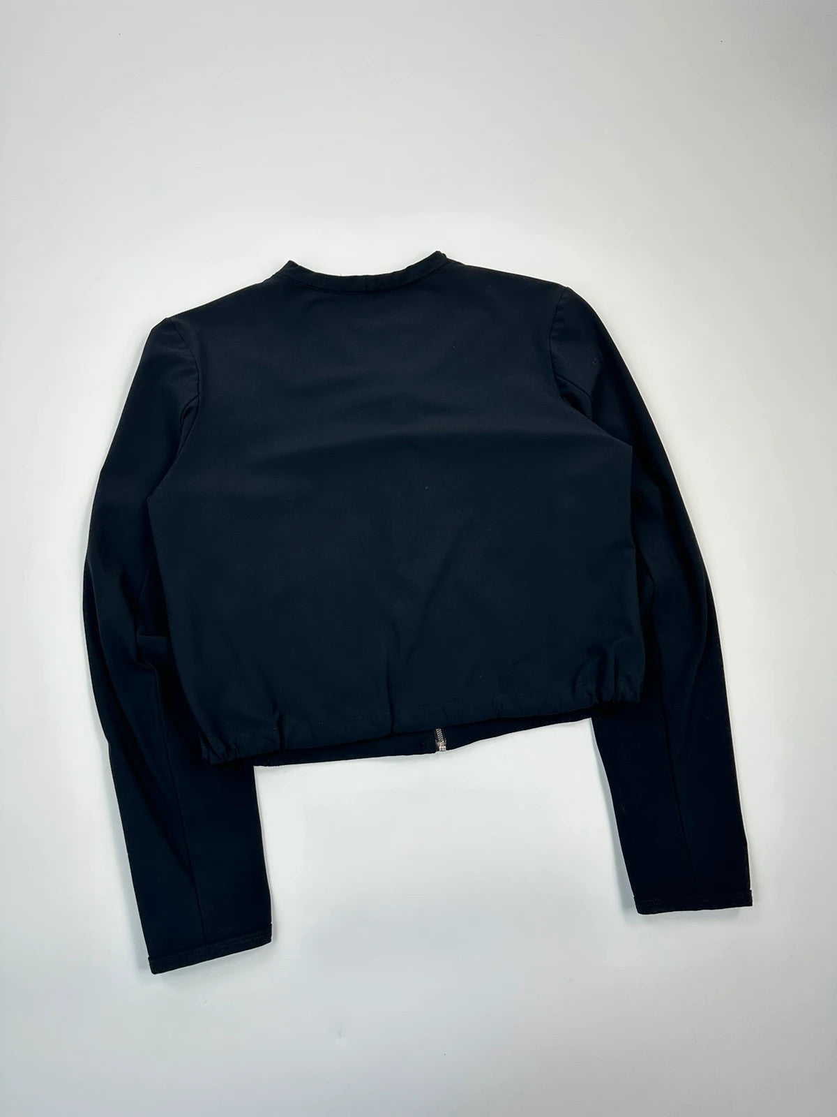Marithé Francois Girbaud navy crop jacket with V-neck and minimalist design.