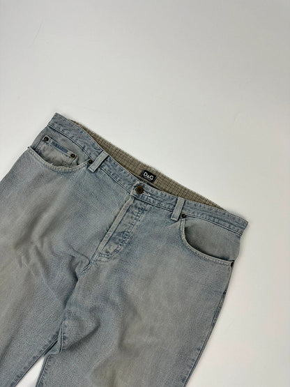 Dolce & Gabbana blue straight jeans with washed finish and back belt detail.