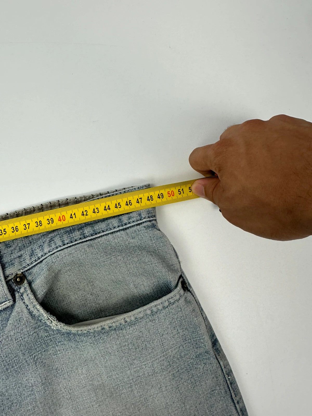 Dolce & Gabbana blue straight jeans with washed finish and back belt detail.