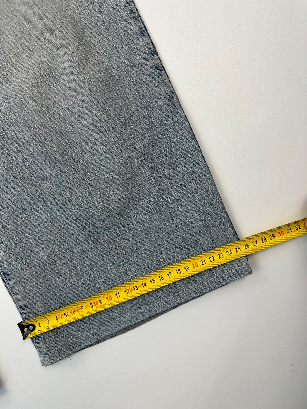 Dolce & Gabbana blue straight jeans with washed finish and back belt detail.