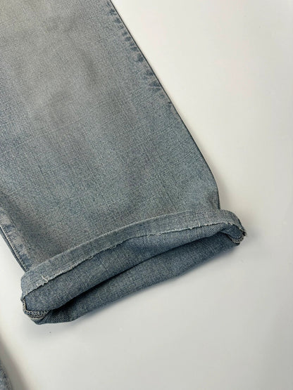 Dolce & Gabbana blue straight jeans with washed finish and back belt detail.