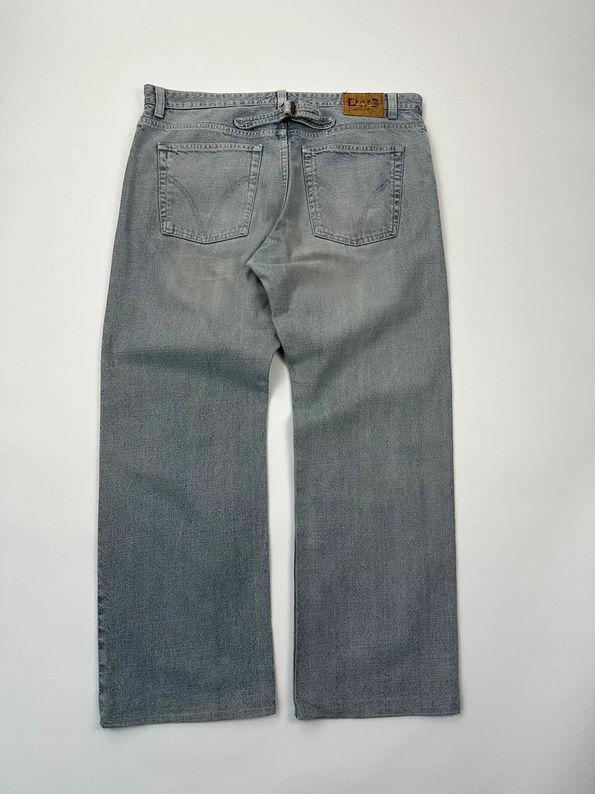 Dolce & Gabbana blue straight jeans with washed finish and back belt detail.