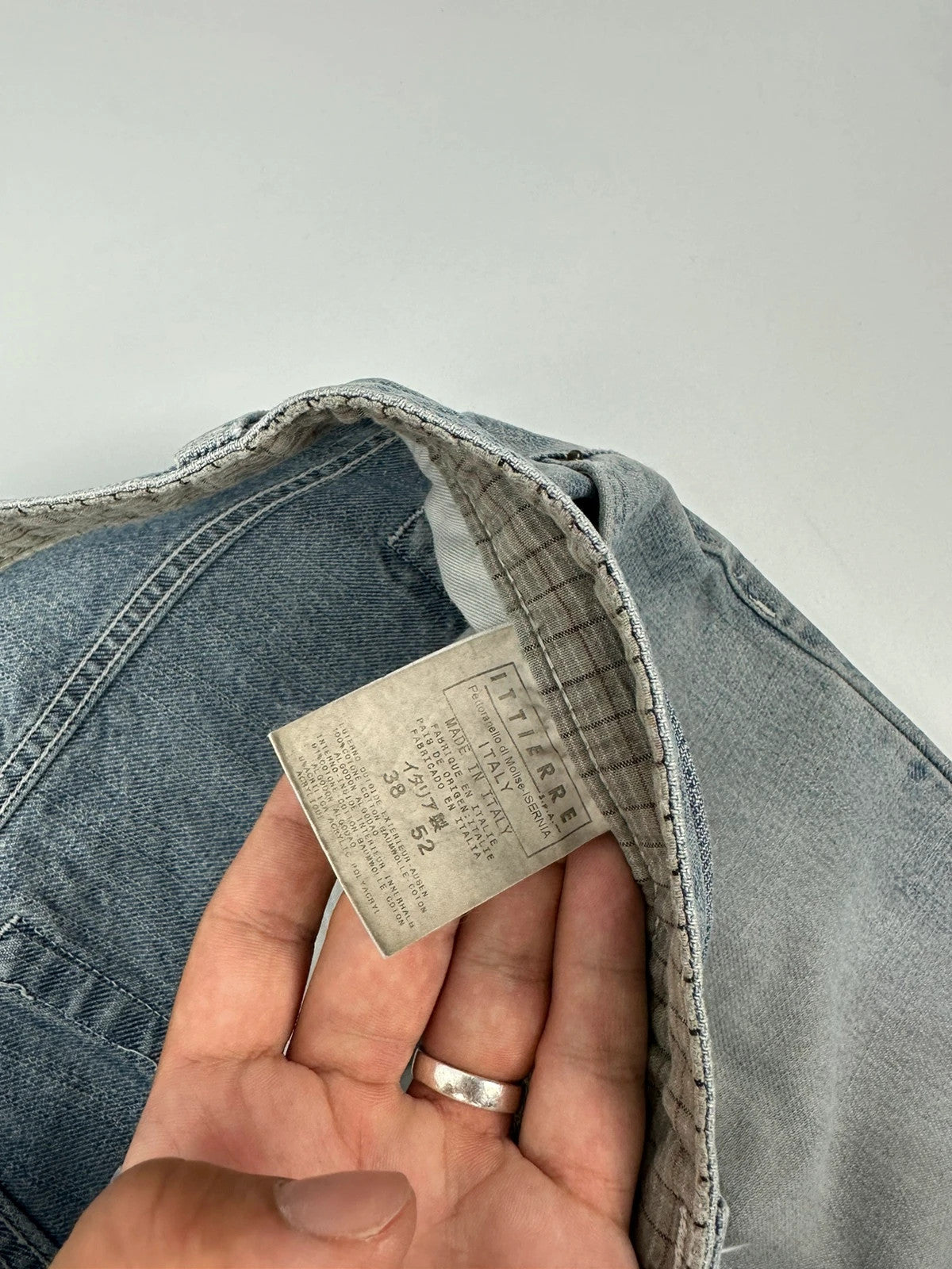 Dolce & Gabbana blue straight jeans with washed finish and back belt detail.