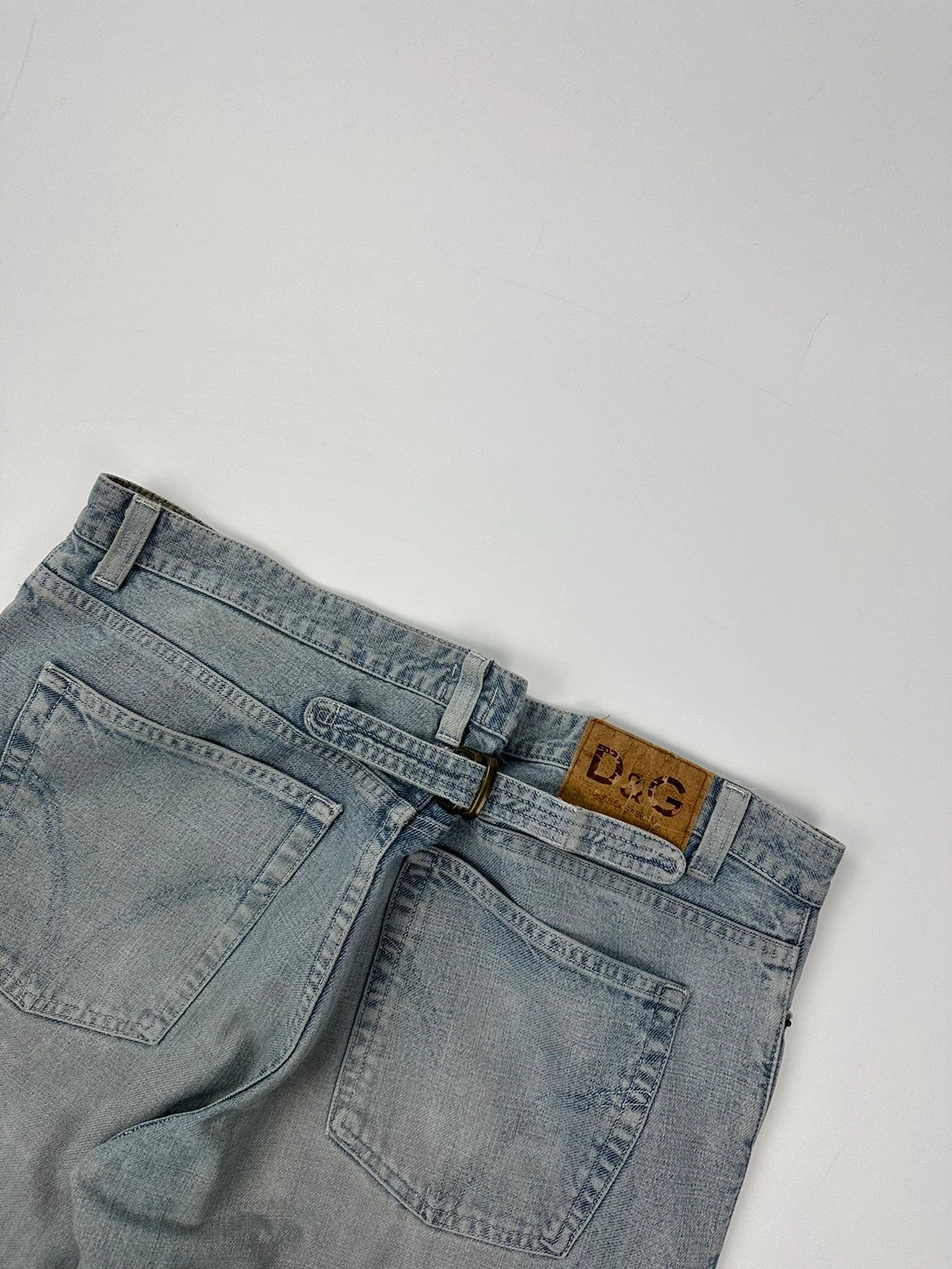 Dolce & Gabbana blue straight jeans with washed finish and back belt detail.
