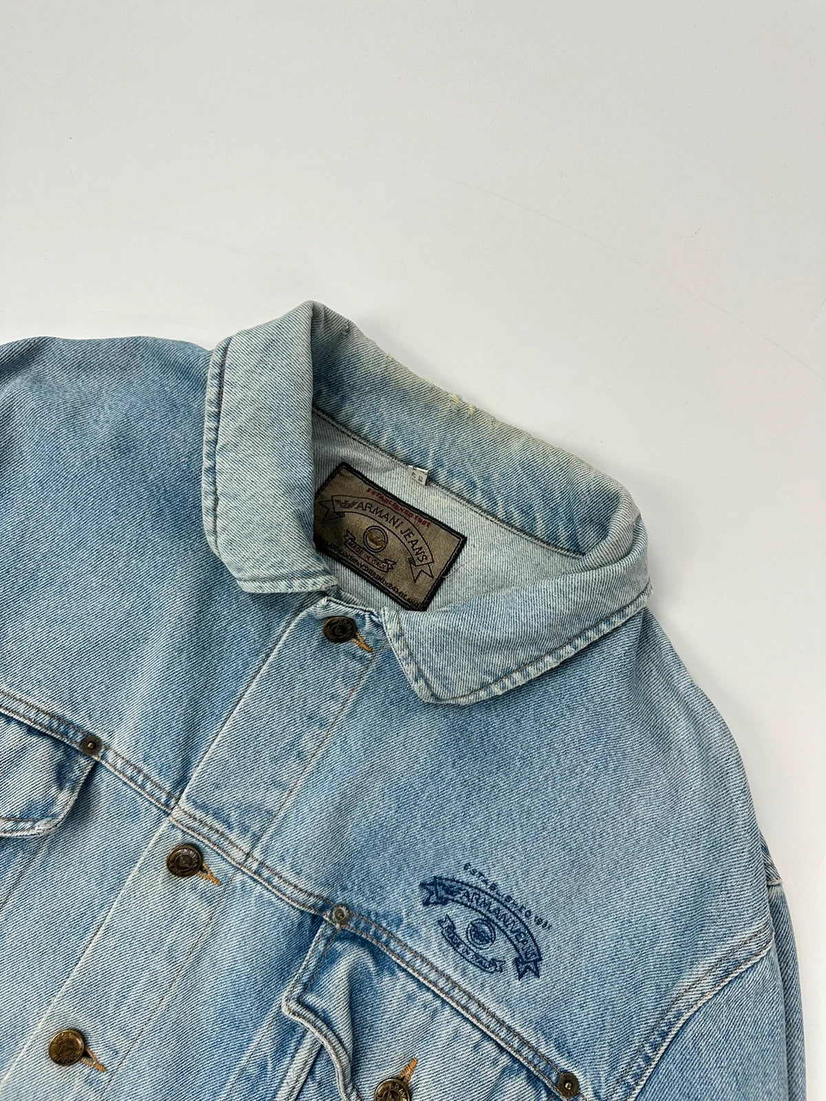 Armani Jeans blue denim jacket boxy cut with light wash and vintage 90s style.