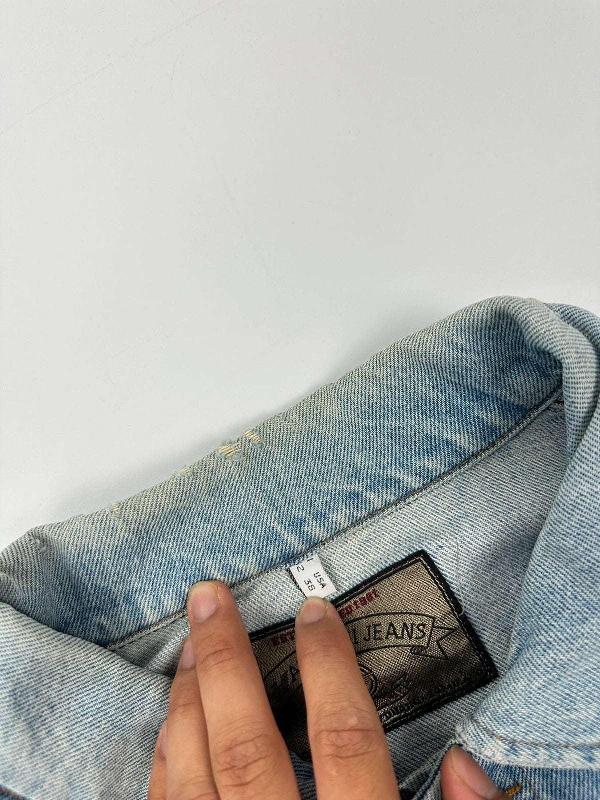 Armani Jeans blue denim jacket boxy cut with light wash and vintage 90s style.