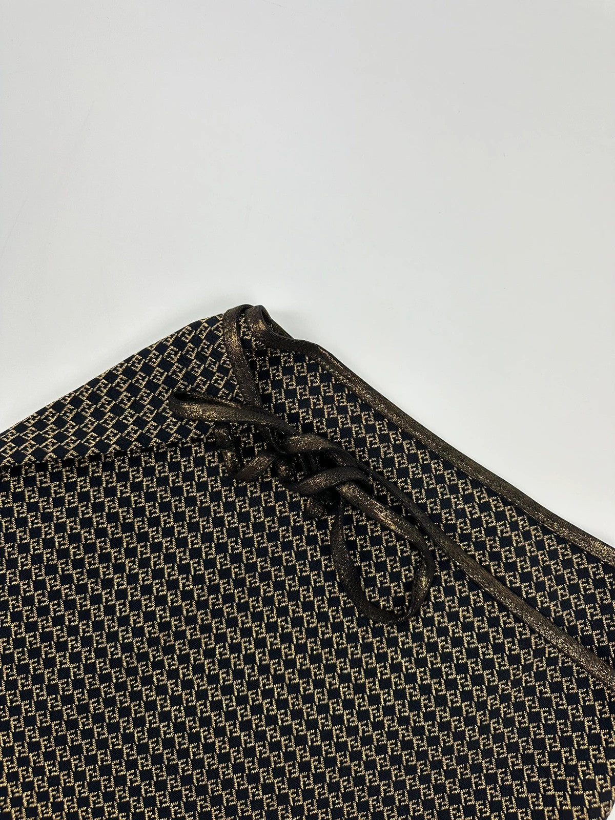 Fendi black and gold jacquard wrap skirt with woven monogram pattern and adjustable ties.