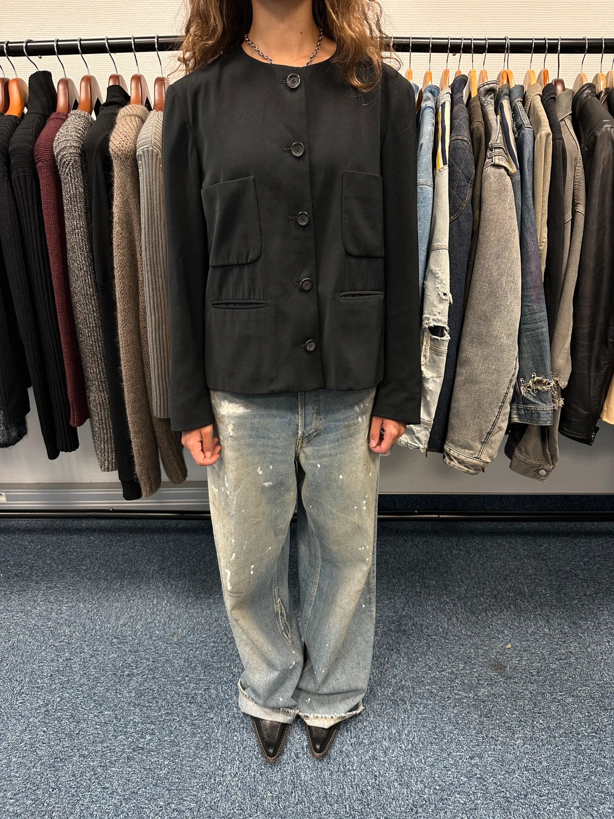 Marithé François Girbaud black jacket with adjustable shoulder pads and minimalist design.