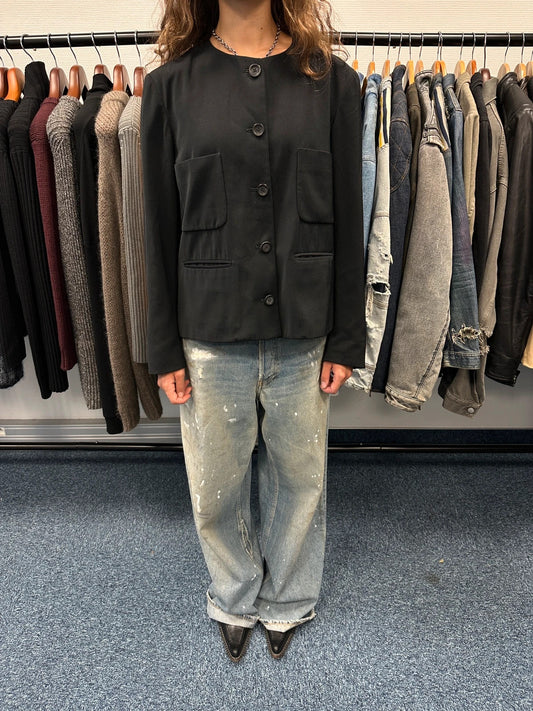 Marithé François Girbaud black jacket with adjustable shoulder pads and minimalist design.