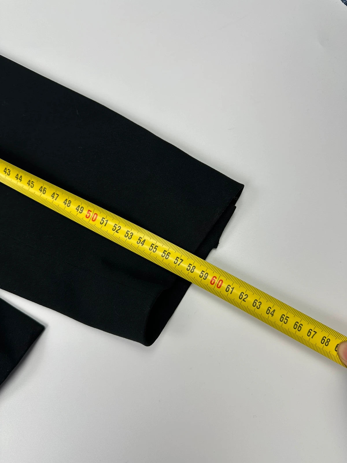 Marithé François Girbaud black jacket with adjustable shoulder pads and minimalist design.