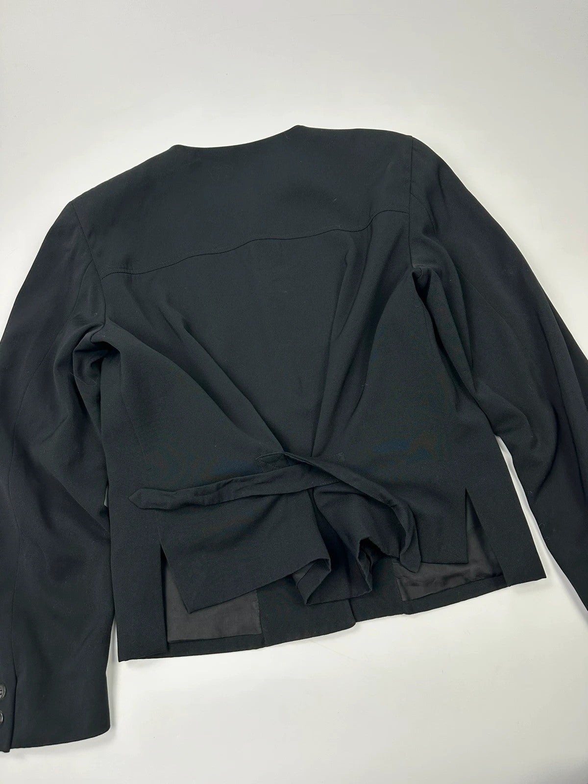 Marithé François Girbaud black jacket with adjustable shoulder pads and minimalist design.