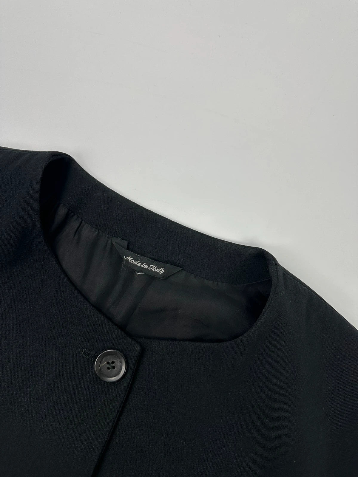 Marithé François Girbaud black jacket with adjustable shoulder pads and minimalist design.
