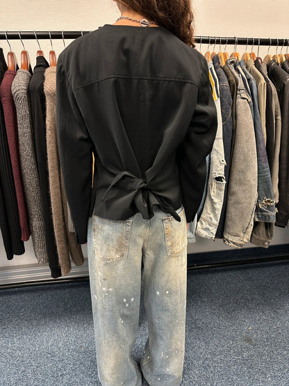 Marithé François Girbaud black jacket with adjustable shoulder pads and minimalist design.