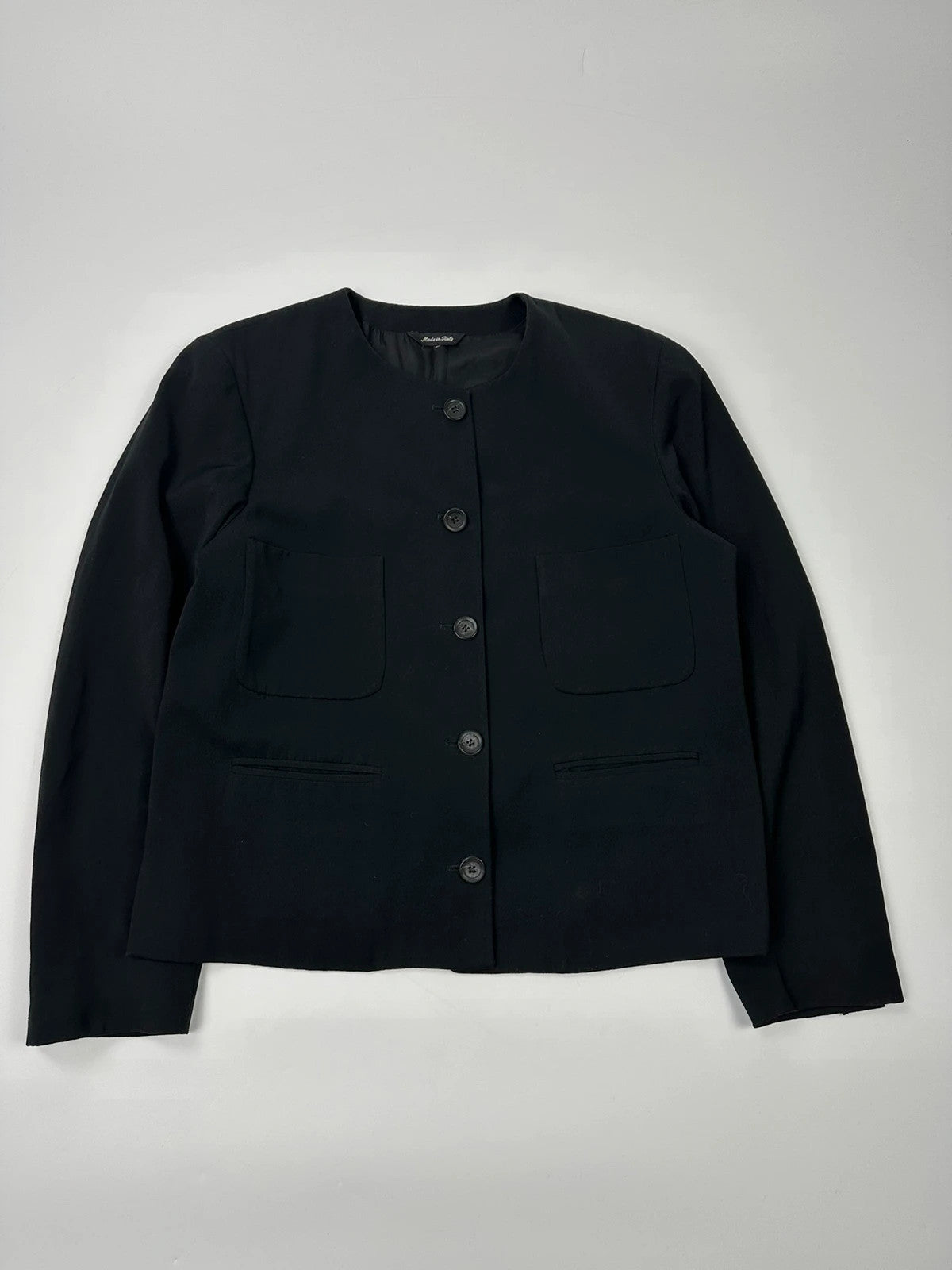 Marithé François Girbaud black jacket with adjustable shoulder pads and minimalist design.