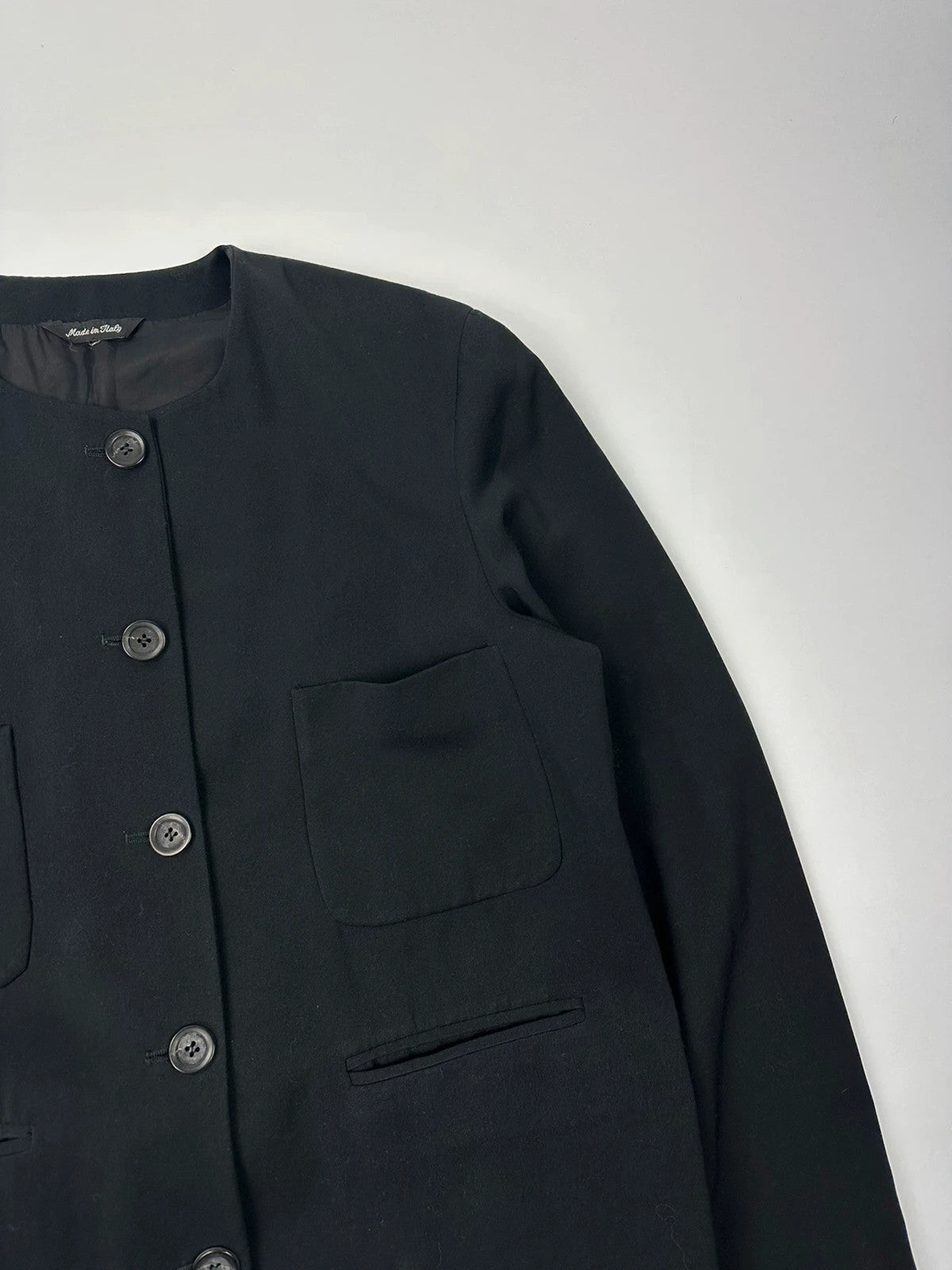 Marithé François Girbaud black jacket with adjustable shoulder pads and minimalist design.
