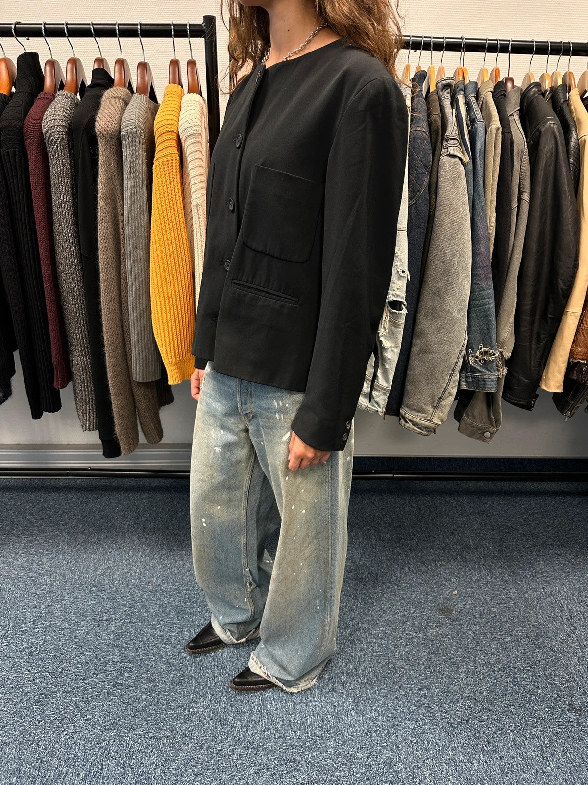 Marithé François Girbaud black jacket with adjustable shoulder pads and minimalist design.