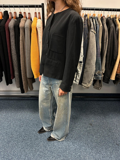 Marithé François Girbaud black jacket with adjustable shoulder pads and minimalist design.