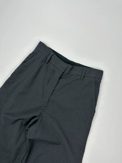 Prada grey wide-leg dress pants with subtle logo detail and luxurious wool material.