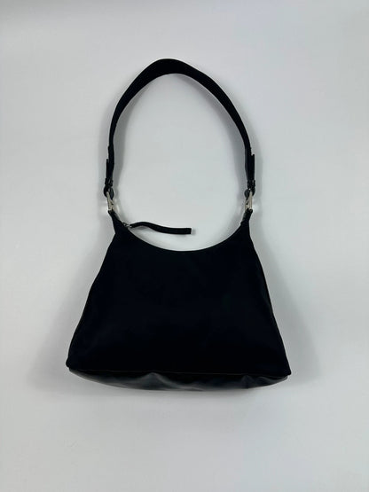 Prada black leather and nylon shoulder bag with logo detail and minimalist design.