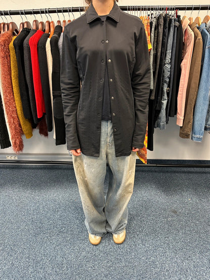 Marithé Francois Girbaud black lycra shirt jacket with minimalist design and vintage style.