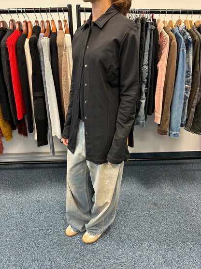 Marithé Francois Girbaud black lycra shirt jacket with minimalist design and vintage style.