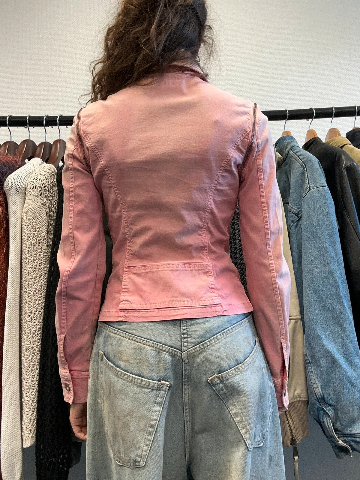 Dolce & Gabbana orange and pink denim jacket with detachable sleeves and cargo pockets.