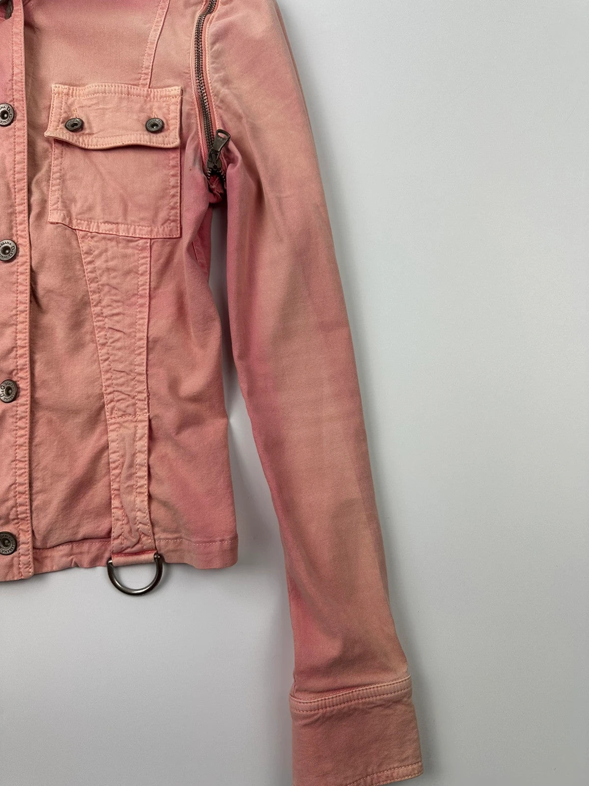 Dolce & Gabbana orange and pink denim jacket with detachable sleeves and cargo pockets.