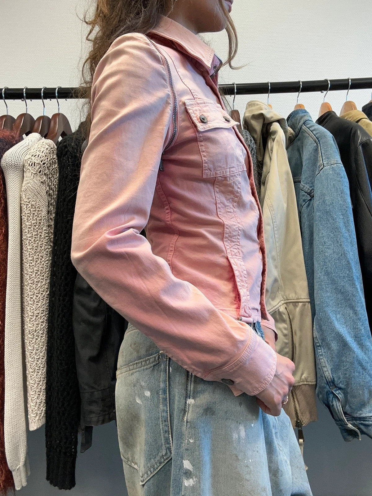Dolce & Gabbana orange and pink denim jacket with detachable sleeves and cargo pockets.
