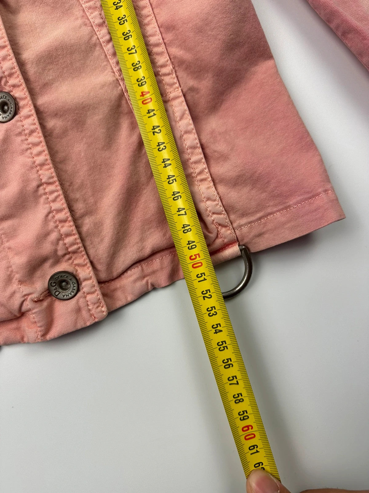 Dolce & Gabbana orange and pink denim jacket with detachable sleeves and cargo pockets.