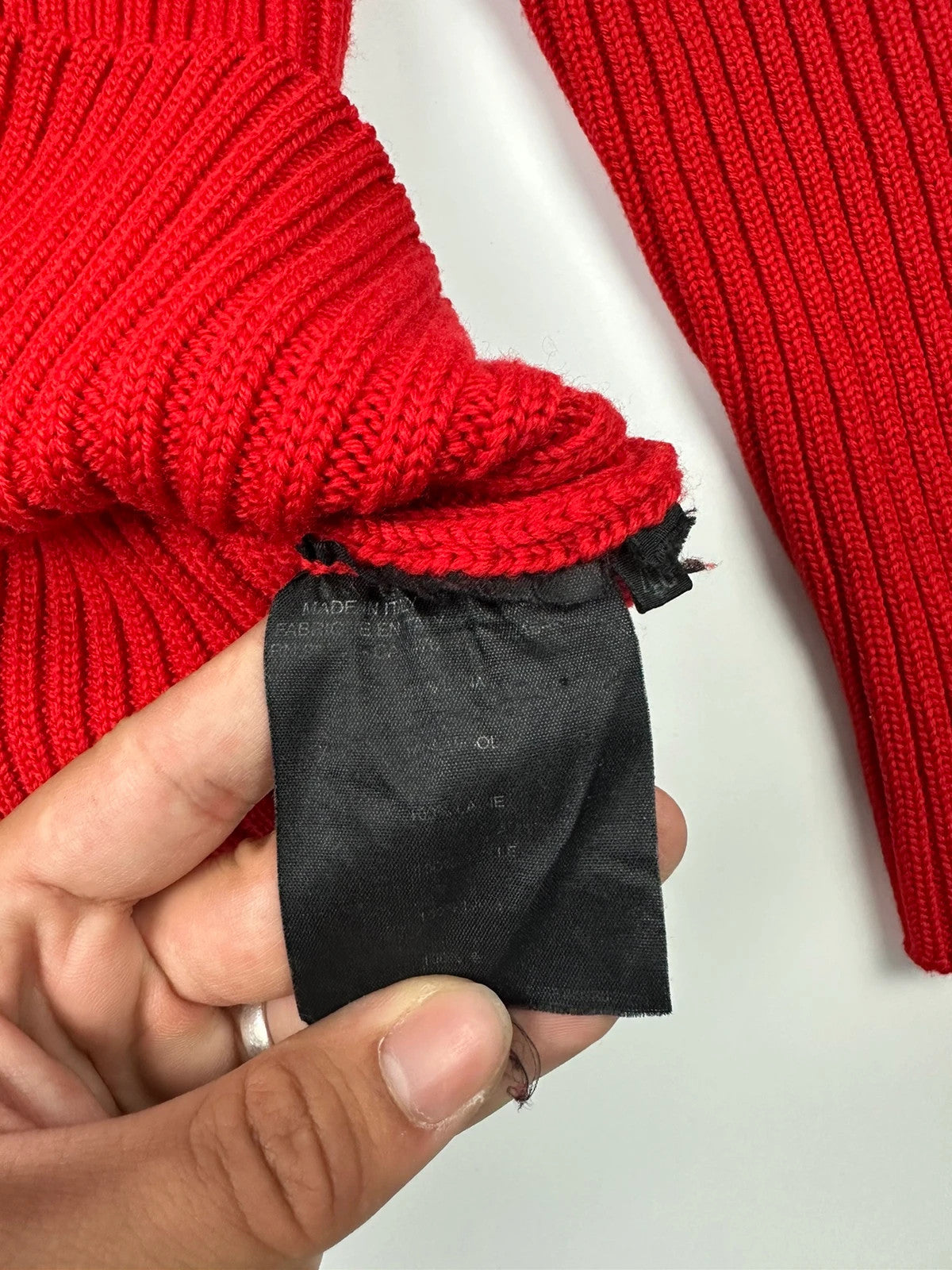 Prada red ribbed wool turtleneck sweater with high neck and Sport collection details.