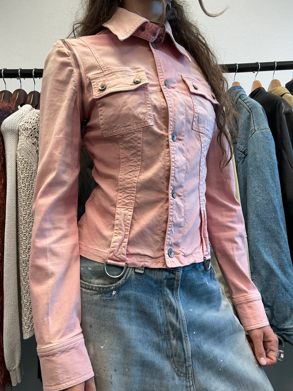 Dolce & Gabbana orange and pink denim jacket with detachable sleeves and cargo pockets.
