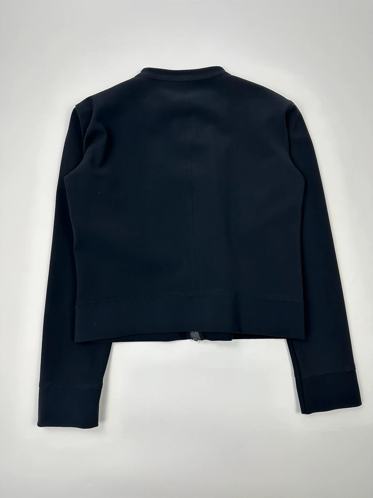 Marithé Francois Girbaud navy jacket minimalist design with subtle branding and smooth fabric.