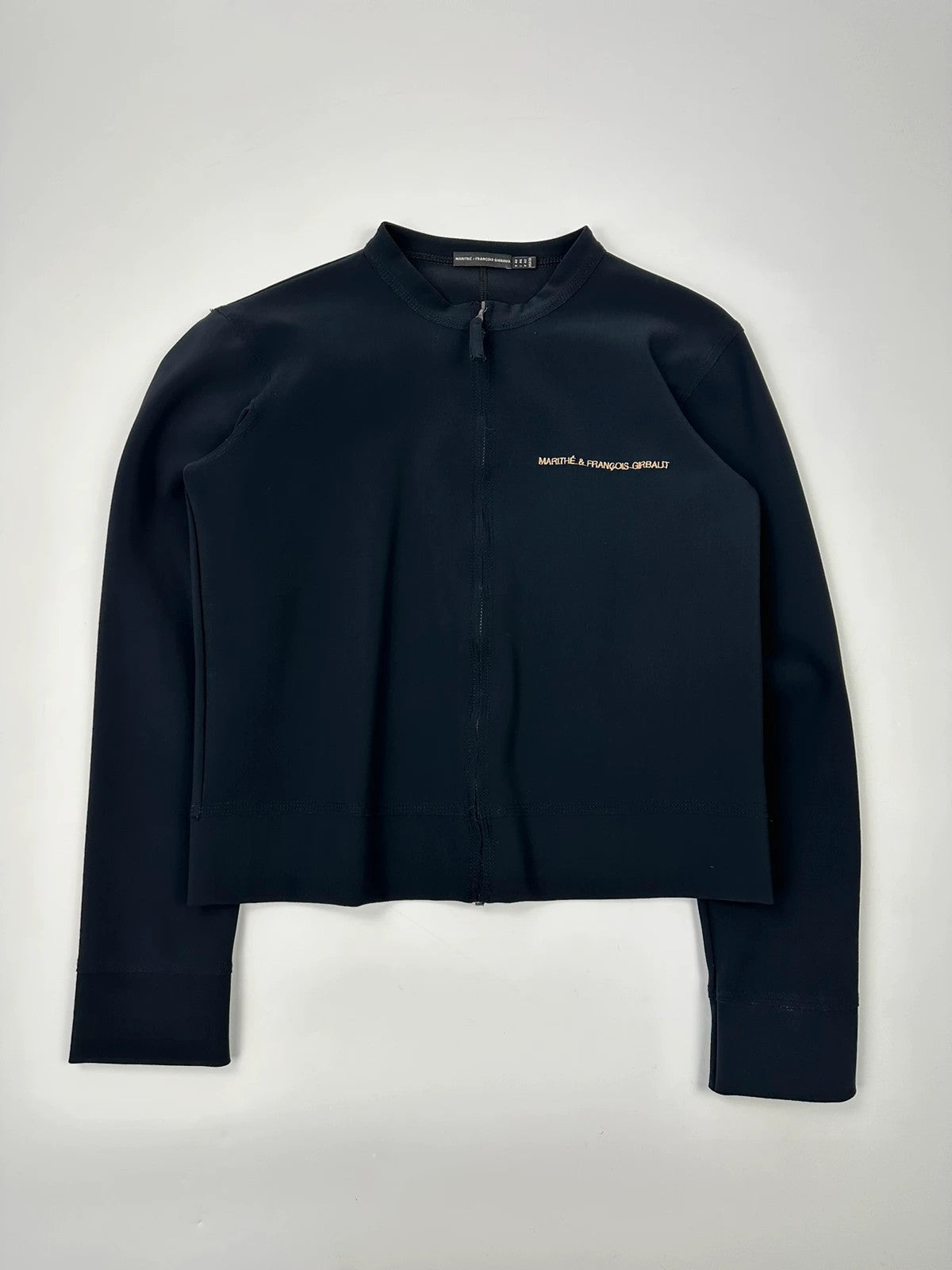 Marithé Francois Girbaud navy jacket minimalist design with subtle branding and smooth fabric.