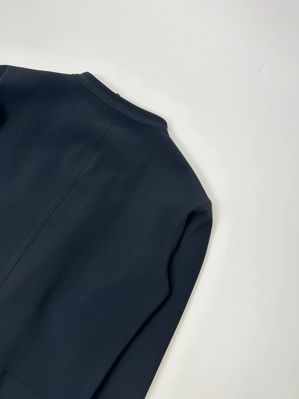 Marithé Francois Girbaud navy jacket minimalist design with subtle branding and smooth fabric.