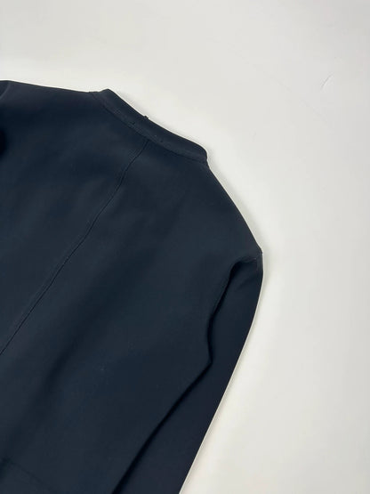 Marithé Francois Girbaud navy jacket minimalist design with subtle branding and smooth fabric.