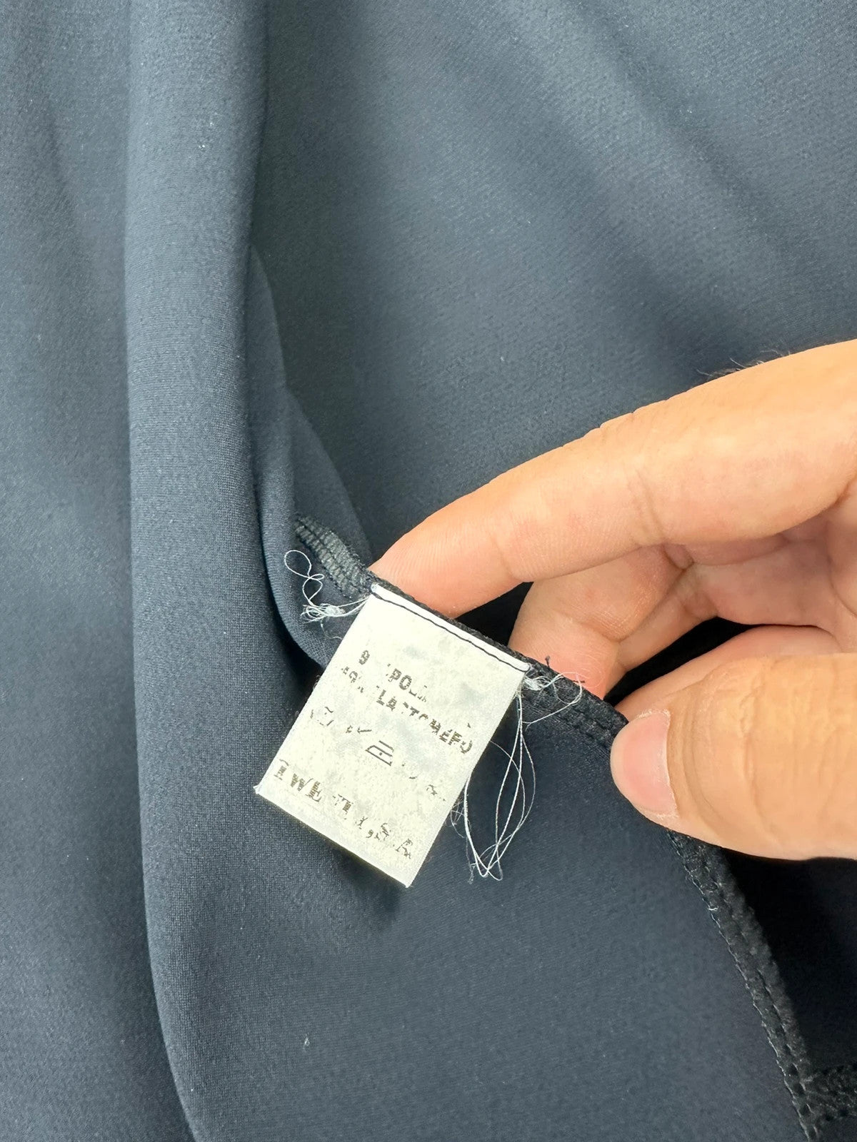 Marithé Francois Girbaud navy jacket minimalist design with subtle branding and smooth fabric.
