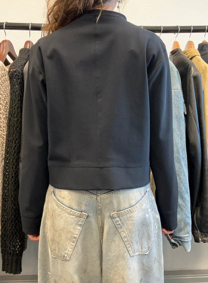 Marithé Francois Girbaud navy jacket minimalist design with subtle branding and smooth fabric.