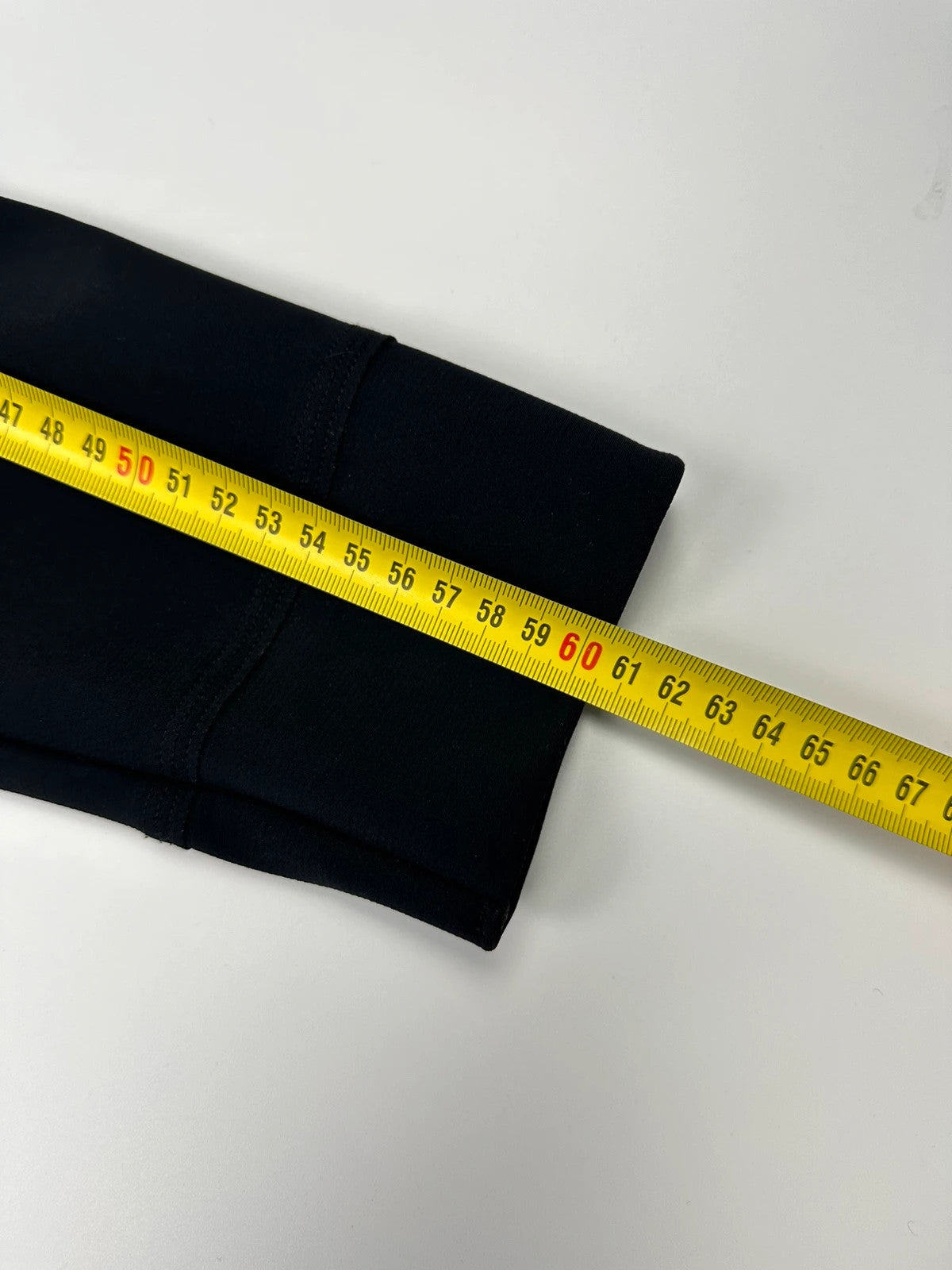 Marithé Francois Girbaud navy jacket minimalist design with subtle branding and smooth fabric.