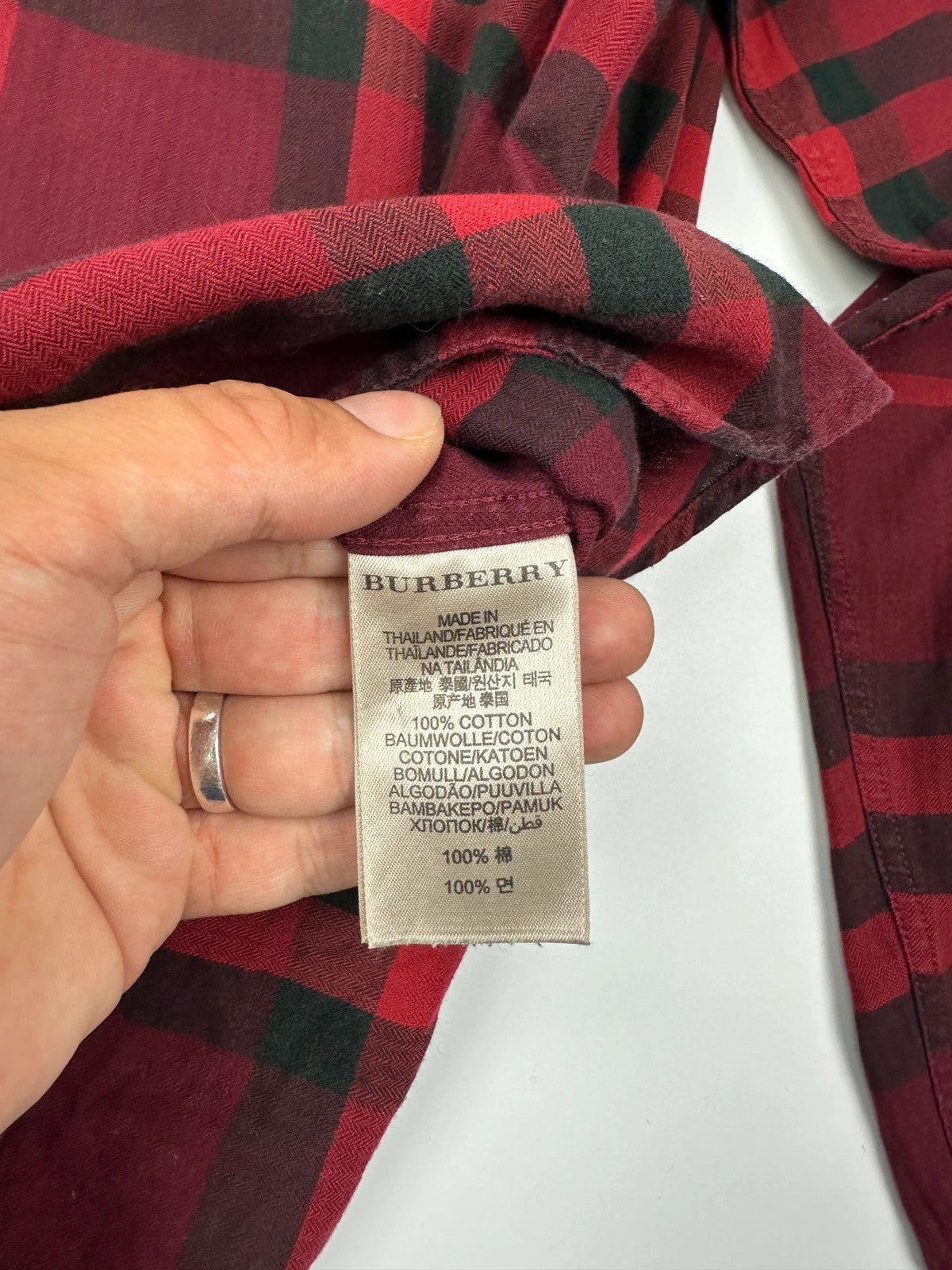 Burberry men's longsleeve shirt red and black checkered tartan pattern with logo detail.