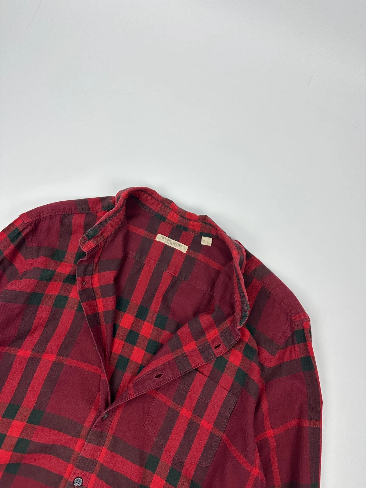 Burberry men's longsleeve shirt red and black checkered tartan pattern with logo detail.