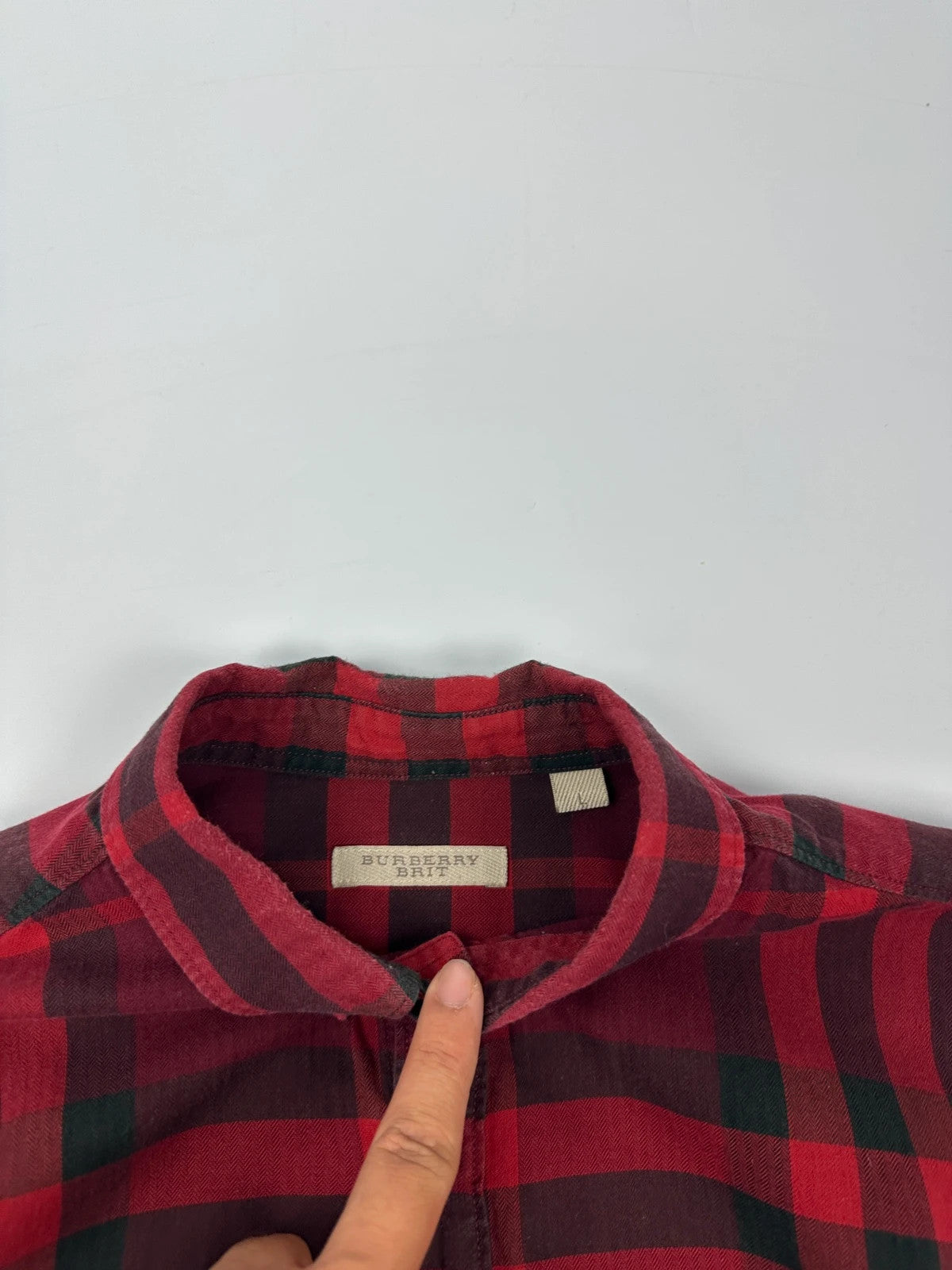 Burberry men's longsleeve shirt red and black checkered tartan pattern with logo detail.