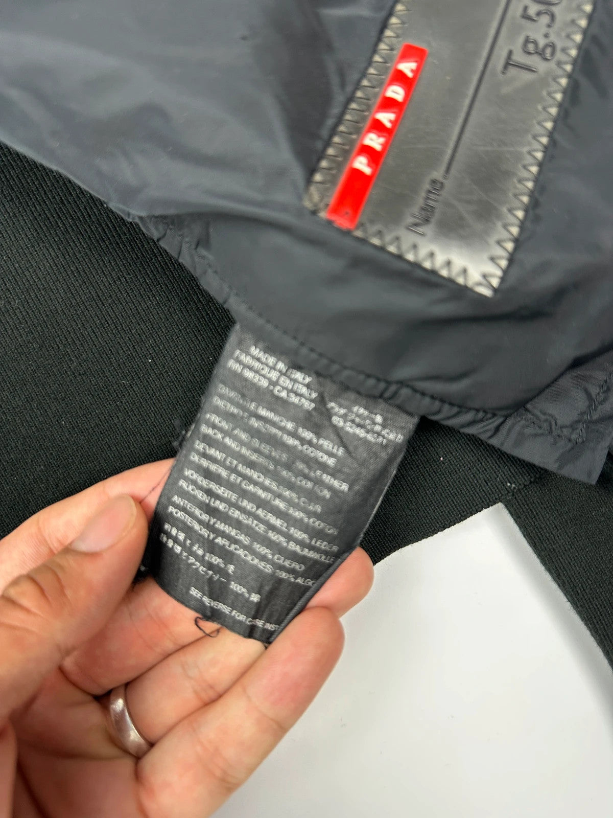 Prada black leather and cotton motor panel jacket with biker-style reinforced details.