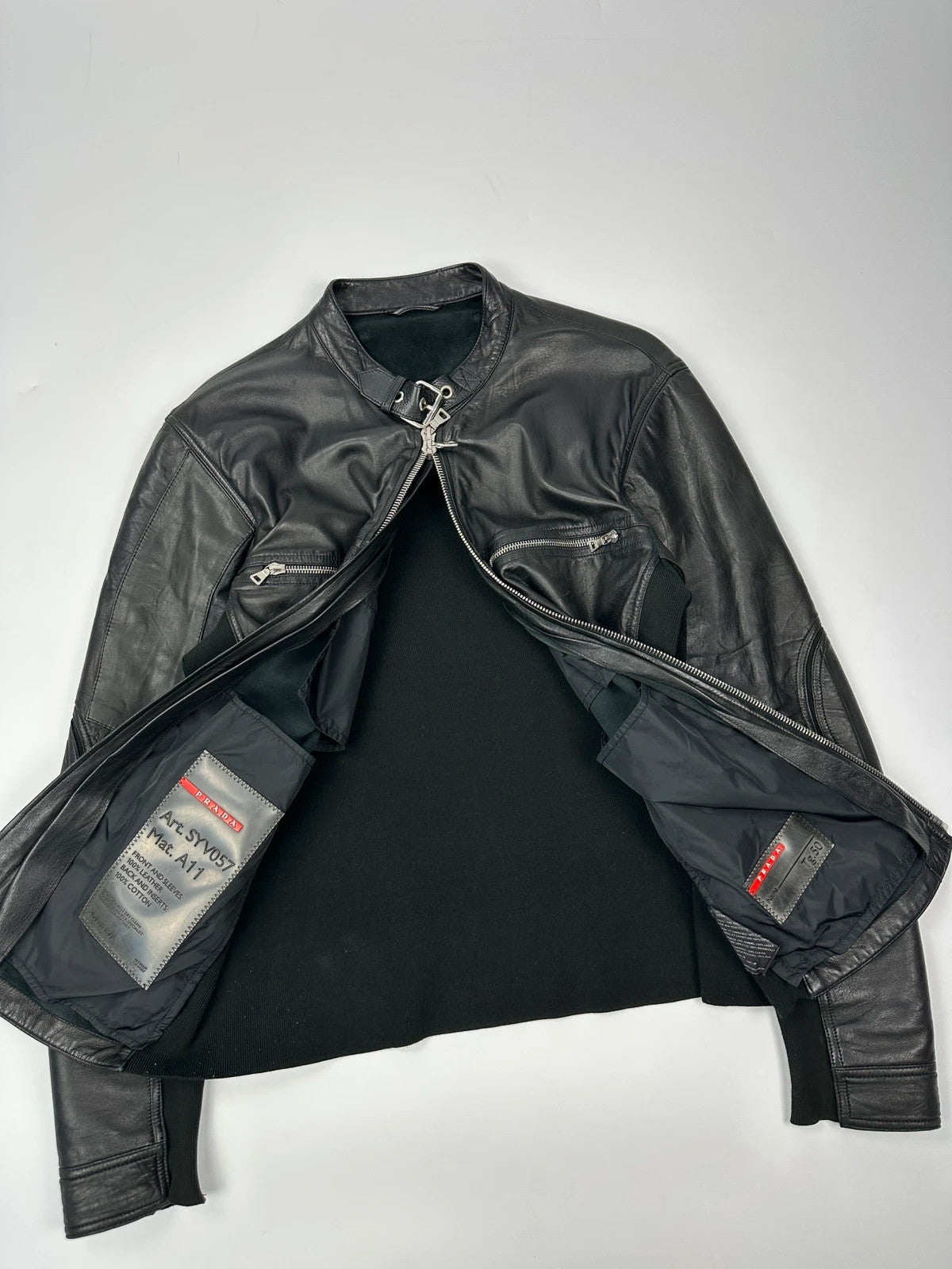 Prada black leather and cotton motor panel jacket with biker-style reinforced details.