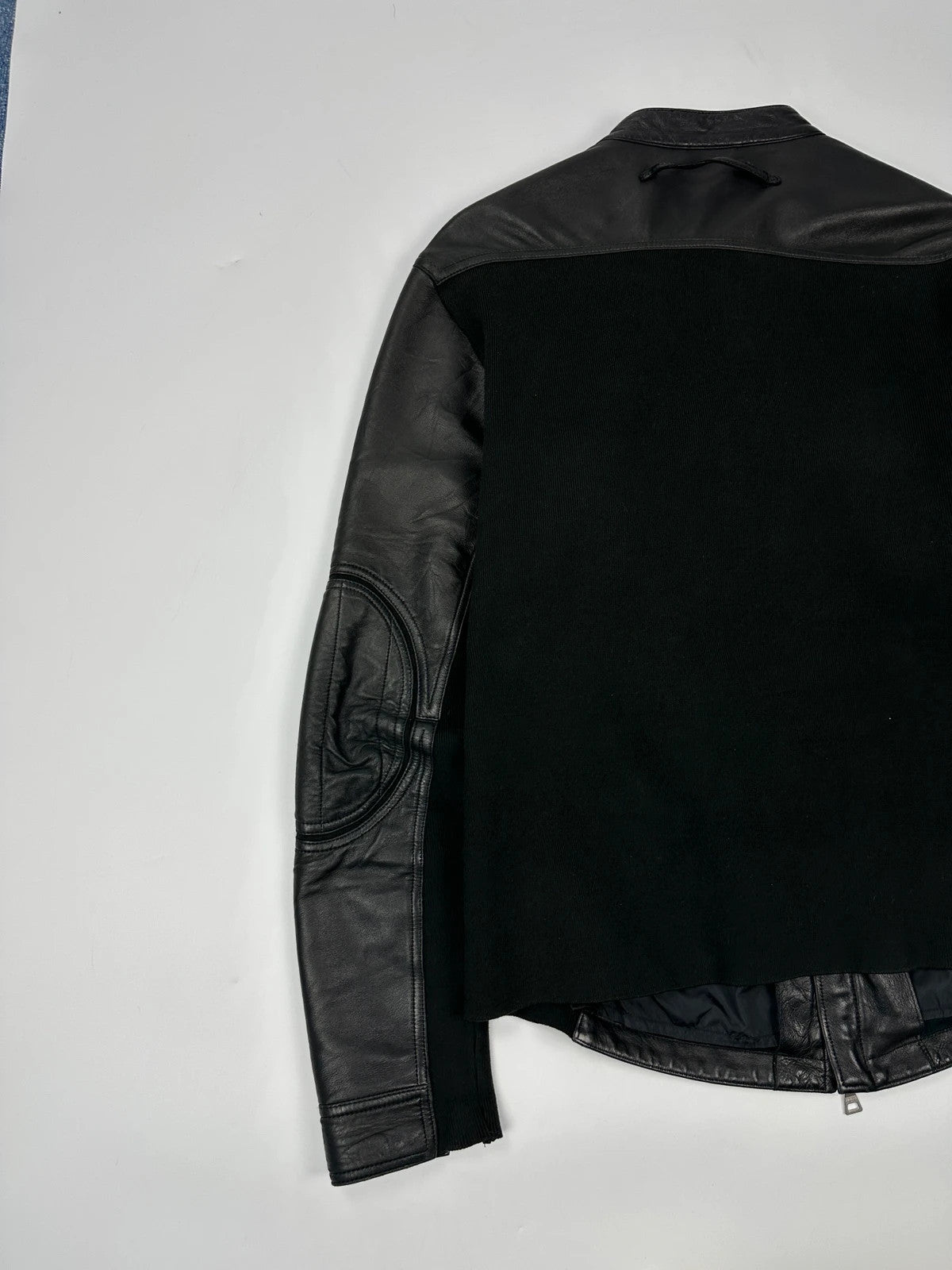 Prada black leather and cotton motor panel jacket with biker-style reinforced details.