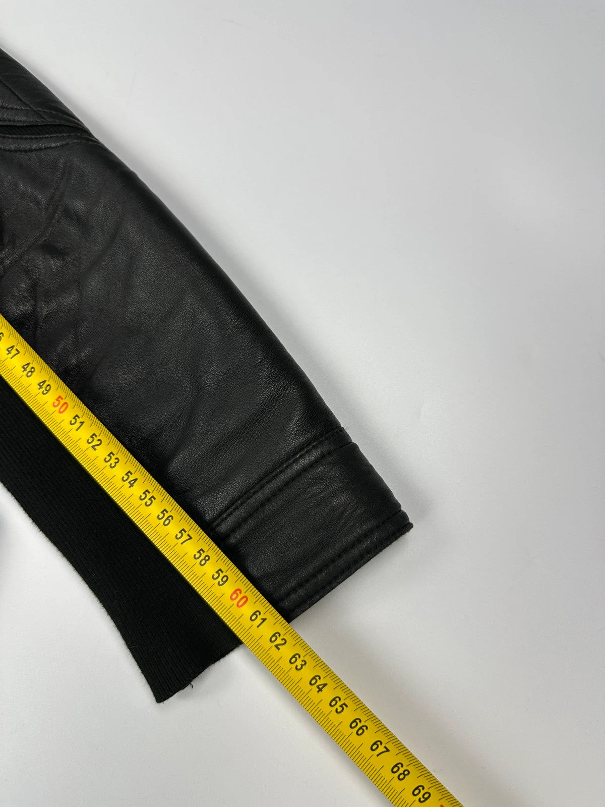 Prada black leather and cotton motor panel jacket with biker-style reinforced details.